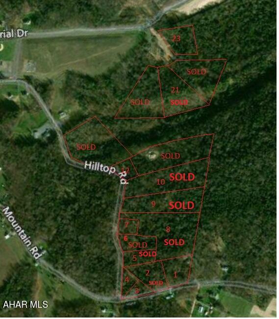 Must see Wooded slight slope to level building lot bordering Mountain Road. Sewer lateral to lot line.  Electric along Mountain Road.  Buyer to drill well. (City water line is a distance away but there is a possibility to extend it to lot at buyer's expense.) Buyer to assume all costs/fees associated with extension/connection to any utility, storm water management and obtaining of necessary permits.
One of the owners is related to a real estate agent(s).  Taxes to be assessed at time of sale.