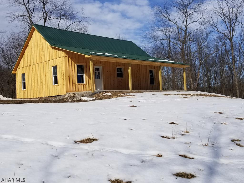 NEW CONSTRUCTION, PERFECT GETAWAY, OR YEAR ROUND LIVING. DON'T MISS OUT ON THIS CUSTOM BUILT HOME ON A PRIVATE 21+ ACRES. GREAT OPEN FLOOR PLAN FEATURING A BEAUTIFUL KITCHEN WITH CUSTOM ISLAND, BLACK APPLIANCES, AND LOTS OF CABINET/COUNTER SPACE. LARGE BATH AND TWO BEDROOMS ON MAIN FLOOR, 3RD BEDROOM/LOFT ON SECOND FLOOR.  MINUTES FROM SHAWNEE STATE PARK AND A SHORT DRIVE FROM BLUE KNOB STATE PARK.  GOLF AND SPA OPTIONS NEARBY AT SEVEN SPRINGS, HIDDEN VALLEY, ROCKY GAP AND THE OMNI BEDFORD SPRINGS RESORT.  DON'T MISS THIS ONE!