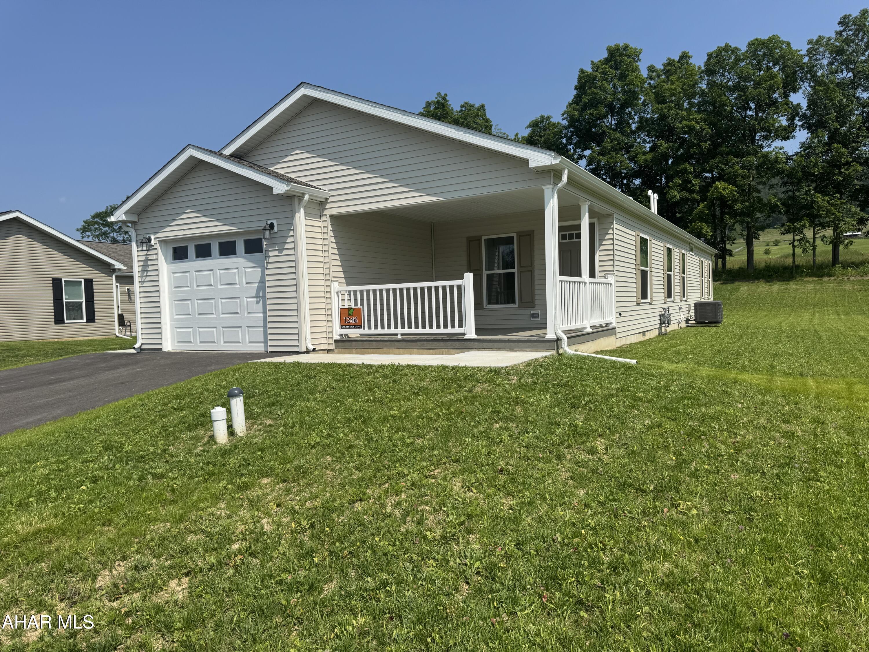 New construction, never-before-lived in, 1-floor, 1-step entry appx. 1,500 sq. ft. 3 bed/2 finest-quality manufactured home.  Set amongst other all-new homes at the newest active adult 55+ community in  region, this home features open living spaces with a feature-packed kitchen, stainless steel appliances, an attached 1-car garage with macadam driveway and covered front sitting porch.  All (underground) public utilities, natural gas heat, high-speed connectivity and a friendly, welcoming community convenient to the region's amenities make this home one to not miss.