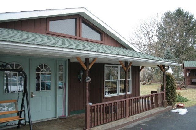 Unique property in a quiet location only a few blocks from downtown Bedford. You will not find another home like it in the county. Stunning cedar log interior with open balcony is just one of many special features. The home was recently renovated to include a main floor master, 3/4 bath and a second main floor bedroom to really utilize the space. A cozy wood stove with stone fireplace warms the family room. Huge eat-in kitchen with oak cabinets and some updated appliances. Balcony with spiral staircase off of second floor master bedroom overlooks the Koi pond and impeccable landscaping. 2 bay windows and skylights fill the home with natural light. An absolute must see property!