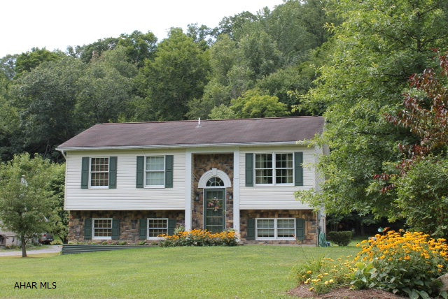 Peaceful setting on the outskirts of Tyrone. Beautifully maintained 3 bedroom, 2 bath home on 1.25 acres with paved driveway, stone patio and a new welcoming sidewalk. Sit on the deck and enjoy this relaxing setting. updated kitchen, fully remodeled bathroom and a great community for families.