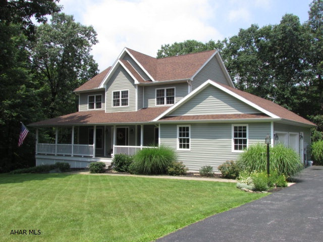 Elegant and immaculate home on almost 2 acres in Warriors Mark area. Hardwood floors lead you through the wide foyer to the open living room, then breakfast nook with bay window, past the staircase, to the kitchen and then the dining room. A great feature is the large mud room that leads to the laundry and half bath. The kitchen is updated with a new quartz countertop & ceramic backsplash. NEW Master Bath with a quartz two-bowl countertop, oak vanities, shower with a Corian surround and diagonal ceramic tile - a great contemporary look. Large family room with work-out area and sliding doors to patio. Large front porch that wraps around the left side and meets the open back deck. There's a patio below the deck plus storage under the side porch. NEW siding! Semi-private. Easy access to I-99!