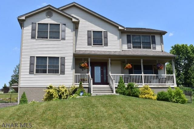 Well maintained home with a covered porch & inground pool.  Great for entertaining.