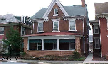 Stately brick 2 1/2 story;charming older home with good machanics;large living room with functional fireplace and french doors. formal dining room, eat in kitchen, 3Br, bath and finished 3rd floor