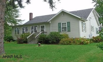 1 1/2 story 3BR/2.5BA with detached workshop. Central AC, well, city sewage, newer kitchen, appliances included. New windows, covered porch and close to town and schools. Beautiful cape cod style home with 3BR/2.5BA. Central air, oil forced air heat, vinyl siding, newer windows, new kitchen with refrigerator, stove, dishwasher and freezer included. Close to schools and shopping,