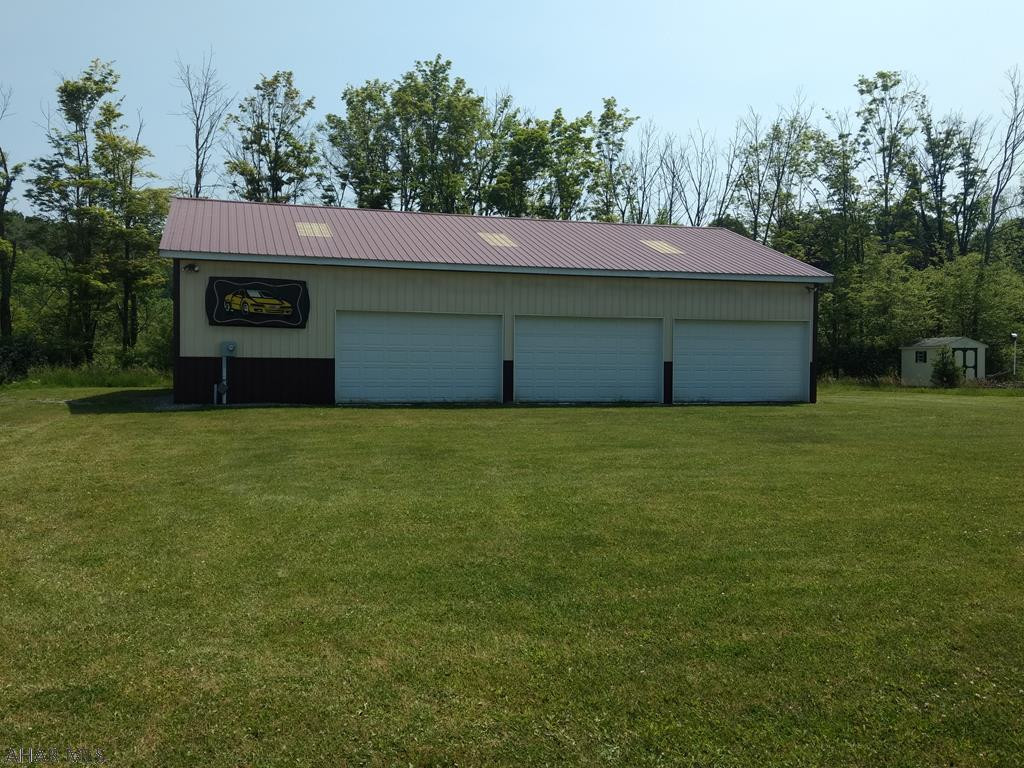 This 40x60 metal, insulated building is perfect for storage.  Heated with oil radiant heated floor.  This property has no water and no sewer to property.  200 amp electric service.