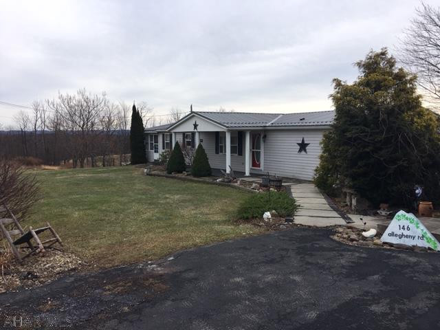 One-owner, open and spacious ranch-style home on 5.6+ acres! Private master bedroom with a full bath and 2 additional bedrooms with guest bath. Vaulted ceilings in living and dining rooms with large bay windows and mountain views! Oak kitchen was recently remodeled and offers an abundance of seating, center island, and tons of cabinets. Enjoy the 3-season room and deck, plus first floor laundry!  Combination heating of electric, wood, and oil (2012 furnace). Large walk-out basement, detached 2 car garage, 2 car carport, shed. Metal roof new in 2019. Nicely landscaped, fruit trees. Less than half hour drive to Seven Springs, Rocky Gap Casino, Flight 93, and historic Bedford!
