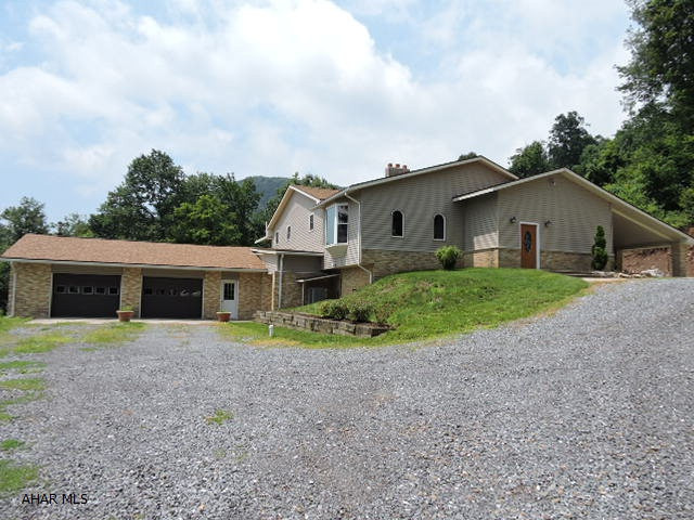 Gorgeous one story home with many luxury features.  Gourmet kitchen with walk-in pantry and stainless steel appliances.  Huge master bath with clawfoot tub and walk-in shower.  Property adjoins State game lands for the hunter.  Basement features a large kitchenette with laundry and big rec room.  Woodburner supplements heat.  24'x40' barn and above-ground pool.  Unheated bonus room off basement for storage or workshops.  Oversized 2-car garage with workshop.
