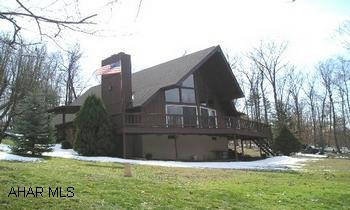 Elegant country contemporary on serene 10/+ wooded acres only 2.5 +/- miles from Cessna.  (Notation:  No drive-bys have been requested by the owners.  The agent accompanying the buyers is to please contact the listing agent/office for directions.) No sign.