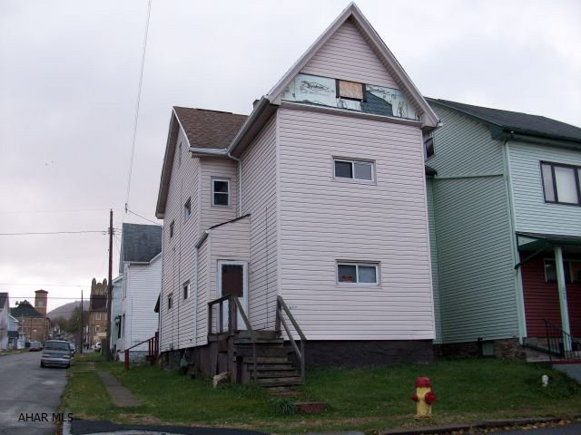 Attention investors!  Mostly interior work needed for this fixer-uppper.  Vinyl siding, newer roof, newer windows.  3/4 bath on the main floor.