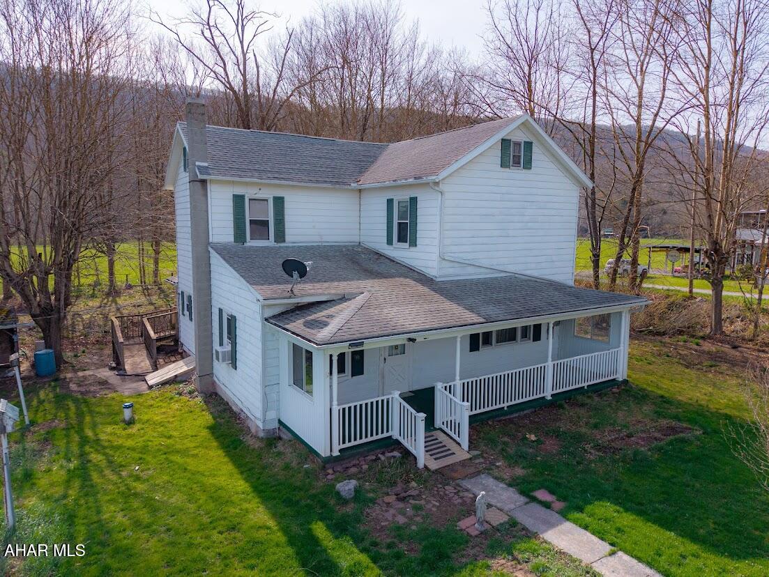 Charming two-story country home full of potential, set against a backdrop of scenic mountain views and open pastures. This 3-4 bedroom, 1-bath property features classic wood floors and high ceilings that add character and warmth throughout. A peaceful stream runs along the property, creating a serene, nature-filled setting. Enjoy quiet mornings or relaxing evenings on the large front porch. The detached two-car garage includes electric, offering great space for storage or a workshop. This home does need TLC , with a little vision and care, it could truly shine as a beautiful rural retreat!!    CASH ONLY!