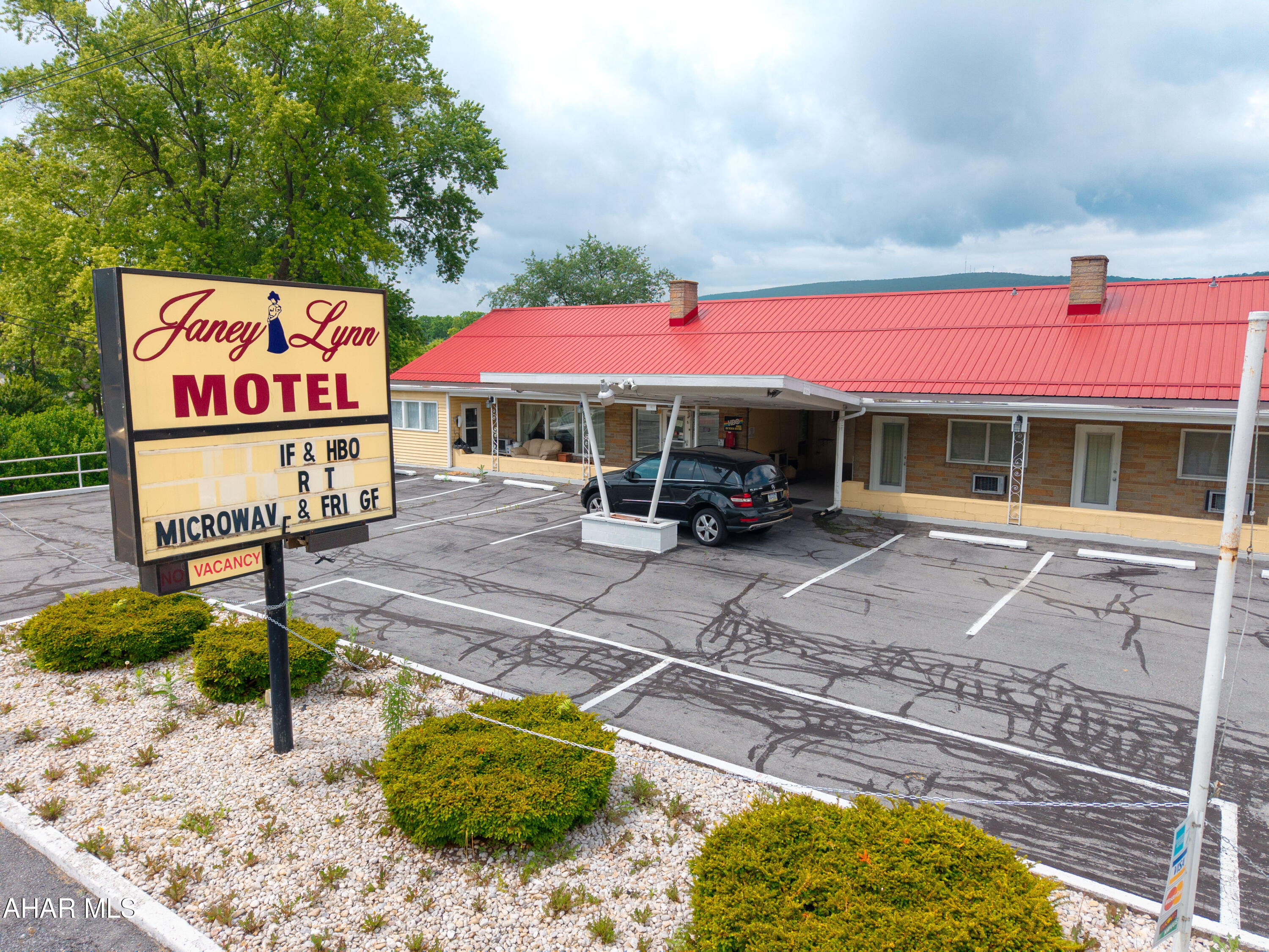 Prime Location Business Opportunity!  This 21 plus room motel plus living quarters/office has been part of the backdrop of Bedford PA since the late 1950s. The Janey Lynn sits at an amazing central location along State Route 220 just outside of the historic town of Bedford.  Under two miles from the PA Turnpike Interchange. Also, very close ski resorts, fishing streams, several golf courses and the Historical Omni Bedford Springs Resort. Great opportunity to own your own business. Not interested in operating a motel?  This property would easily convert into apartments or AirBNB rentals. Make your appointment today to see this property with amazing potential.