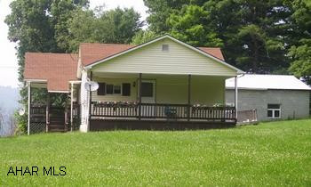 Ranch on 3 acres with detached 2 stall, 896 sq. ft. garage. Mobile home on property, no utilities to trailer. 3 Acres wooded, close to Route 70. Being sold as Short Sale - offer must have lender approval. Many tires on rear of property at creek bed.