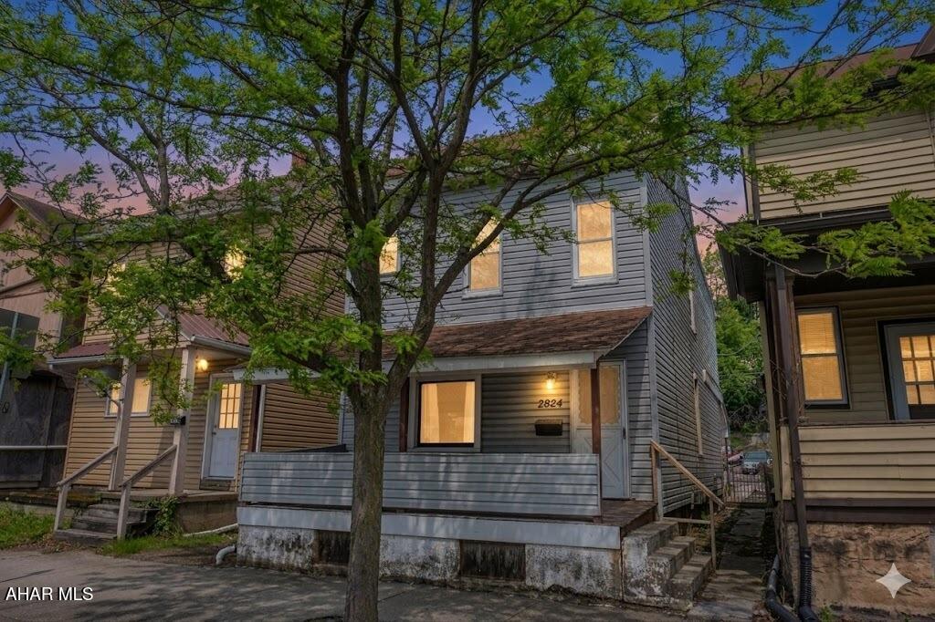 Check out this nicely updated home in Altoona! Step inside and you immediately notice the renovations! There's new flooring and fresh paint throughout. On the first floor you'll find an updated kitchen and living room, laundry area and a bathroom with shower and pedestal sink. There's a beautifully renovated bathroom upstairs with modern fixtures plus two bright and comfortable bedrooms. There is also a third room that would be great for another bedroom or office space - all it takes is a little TLC. The third floor features a spacious attic that could also be used for storage or renovated to create a 4th bedroom or bonus room! There's also a covered front porch and a covered back patio with fenced in yard and off street parking! Matterport virtual 3D tour available! Just ask listing agent for link! Note: Some photos are digitally enhanced.