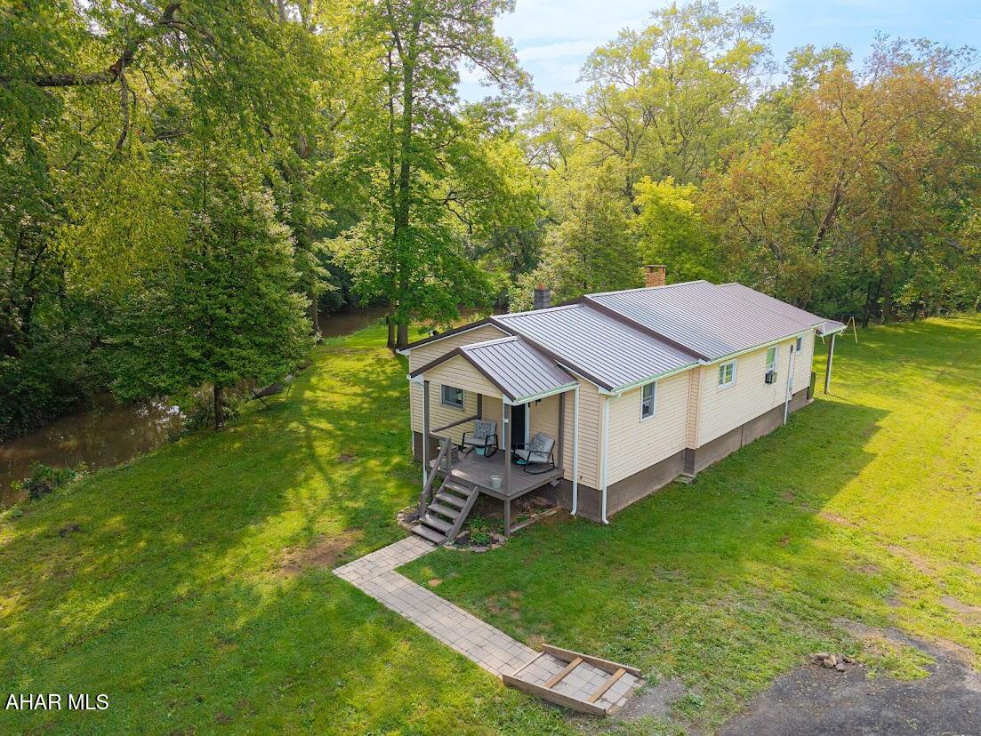 MOTIVATED SELLER!!  Looking at ALL OFFERS!!   A nicely renovated waterfront home on 5.54 acres!!  Open kitchen and dining area. The kitchen has oak cabinetry and new stainless steel appliances.  The living room offers a wood burning stone fire place LP flooring throughout the home giving that nice modern accent. The patio doors from the living room takes you to the back deck giving you views of Adams Run creek and backyard firepit. All the comforts of living next to a creek, with the fire pit for relaxing and enjoying the out doors.  Adams Run Creek flows into Dunnings Creek which is also on the property. Fishing, kayaking, camping and outdoor activities gives you all the comforts of a Home or as a seasonal  Retreat!  Partially Furnished!