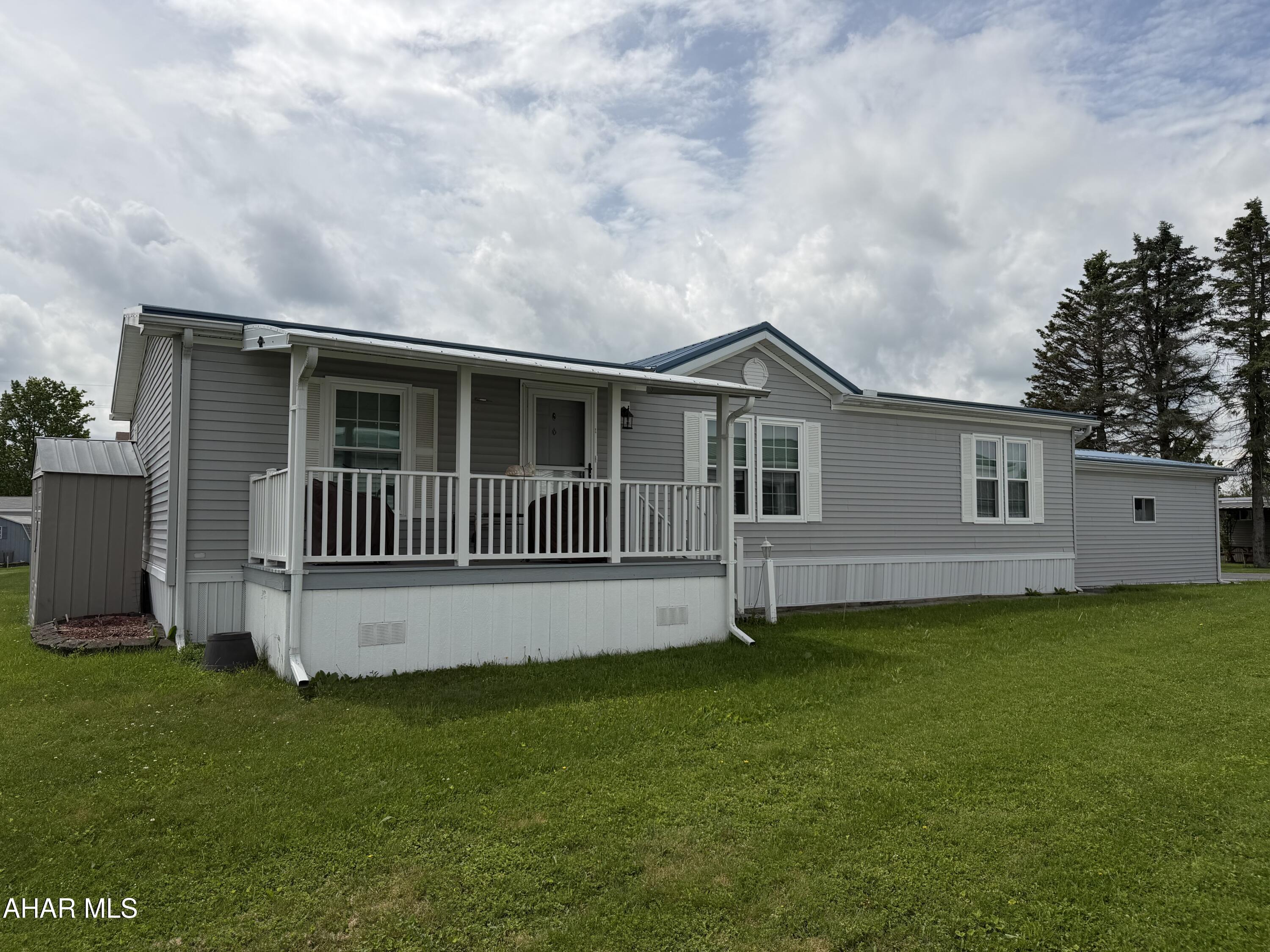 Welcome home to this meticulously maintained double wide, sitting in the Wise Mobile Home Terrace a very desirable 55+ community featuring extremely low lot rent at $230 a month. This beautiful home has a great layout with entertaining at the center of the home.  The kitchen/dining area has space for a large table and has plenty of cabinet space for all your gadgets.  The primary suite sits secluded from the guest quarters, making it very private when out of town guests are here to visit.  The laundry sits right off the primary suite bath room which is very convenient.  There are two porches for entertaining or relaxing and let's talk about the massive garage!  It provides plenty of storage and keeps your vehicle free from snow in the winter.  Newer roof, windows and 2 gas wall heaters will give you peace of mind through all kinds of weather.  Don't miss this rare opportunity.