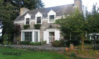 Lovely Two Story cut stone traditional home is an architectural delight. Beautiful manicured gardens. Address: 702 Division Street, Berlin, PA 15530Berlin School District