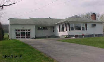 Great 3 BR ranch home with eat-in kit, dining area, gas fireplace, and beautiful oak hardwood floors.  New vinyl thermopane windows, newer furnace, gas hot water heat, and newer roof.  New insulation in 2005.
