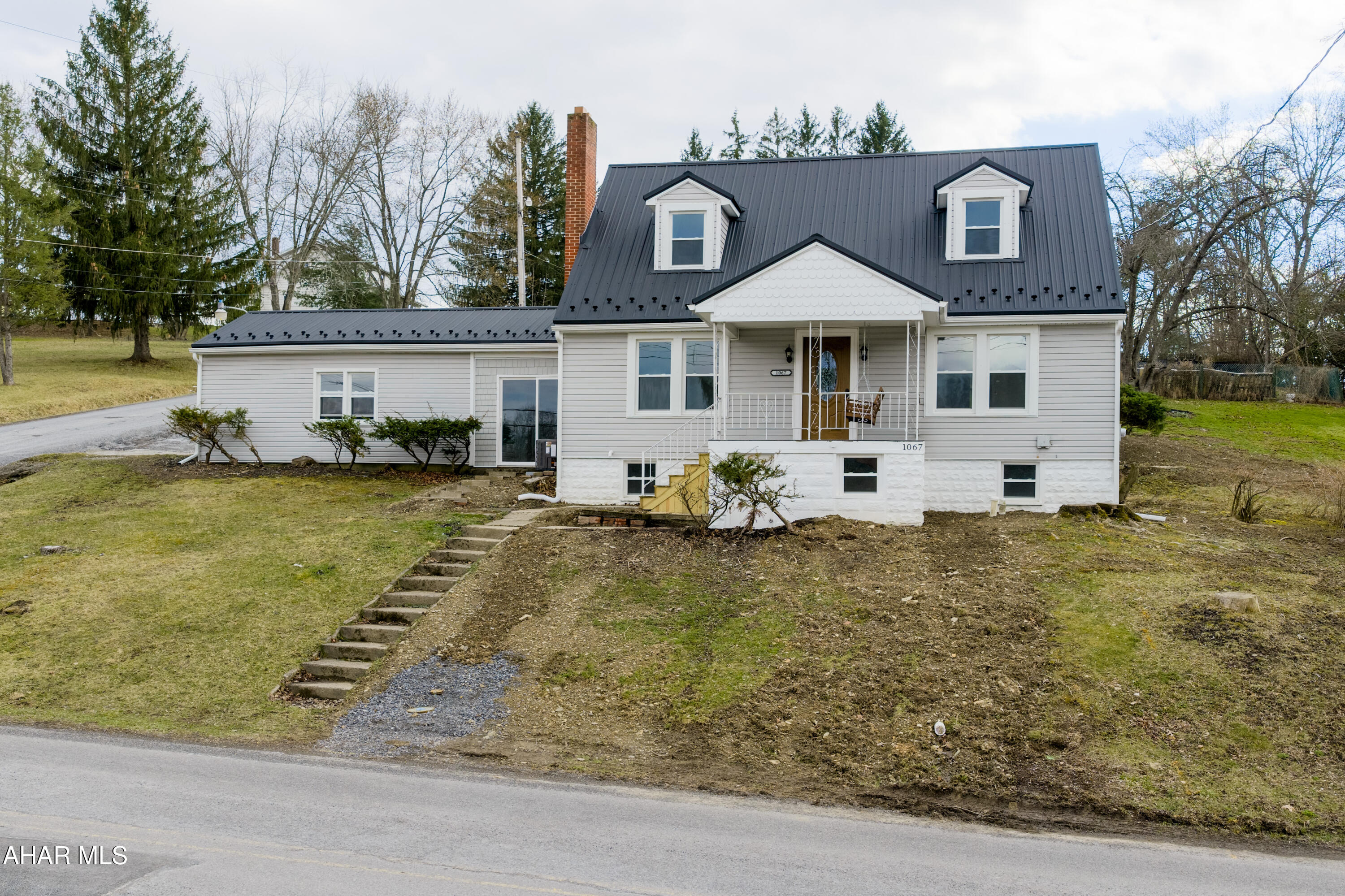 Walking distance to Penn State Altoona!  Situated on a corner lot on just over a quarter of an acre in Juniata this 3-bedroom 1.5 bath home is completely remodeled. With a mix of original charm and modern updates all you have to do is move right in.  A cape cod style home with option for first floor living, open concept, gas fireplace and natural light throughout are just a few of the things this home has to offer. The exterior features vinyl siding, new metal roof, new windows, a front porch, breezeway, and attached garage. See list of improvements and schedule your private showing today.  A property like this will not last!  Property has new city water line, with well as extra water source.
* Seller is offering to purchase, and have chair lift personally installed prior to closing for any buyer who is looking for one story living and ease of convenience on steps (second story contains 2 bedrooms and 1 half bath).
