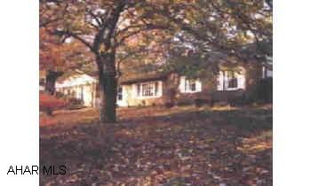 Picturesque setting for this 1800 sq.ft. Rancher on large 150x120 corner lot. Large gracious LR with fireplace. Formal dinning room with corner cupboards. Hardwoood floors throughout except Kit. Foyer has staircase to unfinished attic. Potential 2 bedroom Picturesque setting for this 1800 sq.ft. Rancher on large 150x120 corner lot. Large gracious LR with fireplace. Formal dinning room with corner cupboards. Hardwoood floors throughout except Kit. Foyer has staircase to unfinished attic. Potential 2 bedrooms and bath. Beautiful treed lot. Subject to seller obtaining a suitable rental.