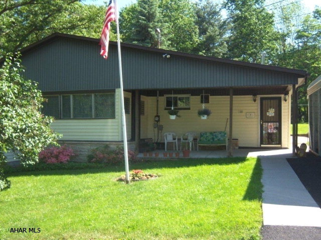 GREATLY REDUCED!!  2 PROPERTIES FOR $125,000 Juniata Gap area nestles this well maintained 1 story home, that is larger than it appears!  3 Bedrooms, 2 Baths, plus an office/Den area (that could be an extra bedroom!) The kitchen is large, bright and open to Dining room.  Just off the dining room is a spacious sunroom with a woodburner. Home offers multi heat source (oil & coal) There is also ample attic storage.  Enjoy the huge 6-bay garage w/electric -(great space for the motorhome) The home is situated on almost 2 acres and best of all, there is a meticulous 2 bedroom mobile home (on full foundation) that rents for $500 per month!!! Great opportunity for single family that also wants an income producing property, or use as mother in law type situation and keep family members close by.