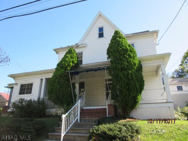 Loads of potential! 3 car attached garage at basement level with elevator, bonus room off of bedroom could be additional bedroom, 2 additional bonus rooms, huge living room