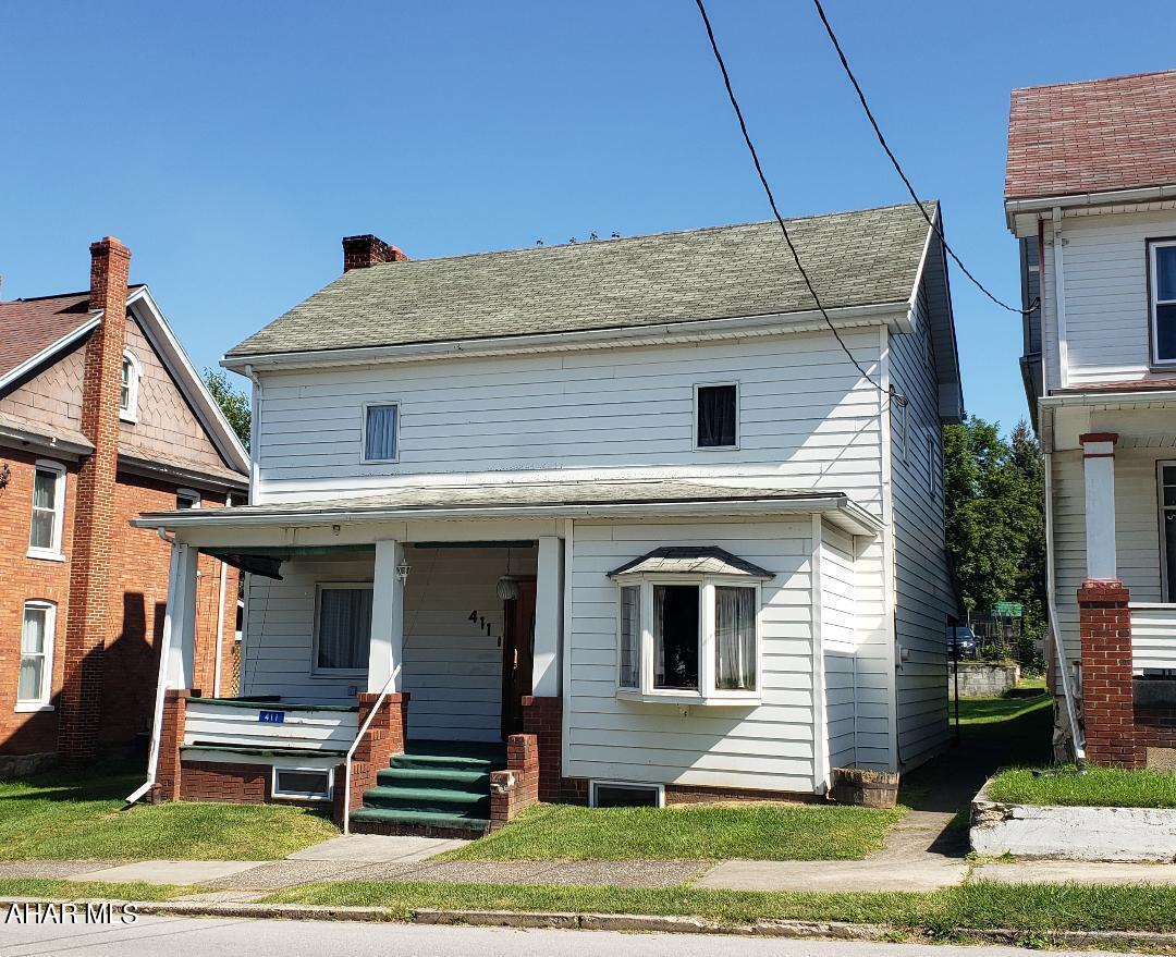 3-bedroom 1 3/4-bath home with formal dining room, 1st floor bonus room, 1+ car detached garage with work benches + storage above on 50x150 lot. J-631