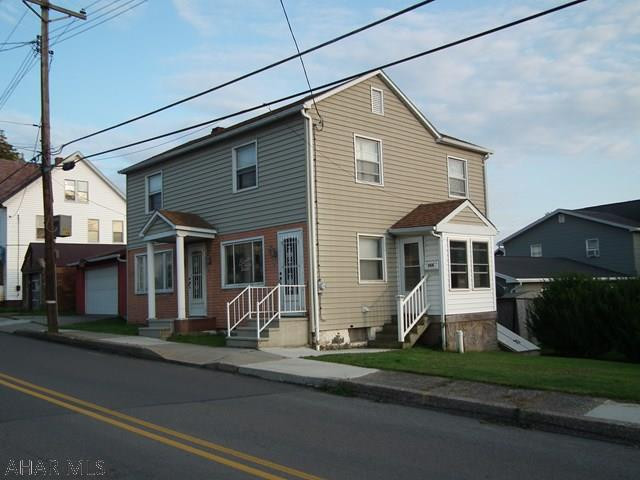 Take a look inside, 3 bedroom, 2 bath, detached garage on 150 x 50 corner lot. Freshly painted, new kitchen flooring, hardwood in living room, 2 full baths (bath on first floor walk-in shower), hardwood under carpeting in bedrooms, enclosed porch and detached garage. Ready for your family now. Husband of agent is owner.