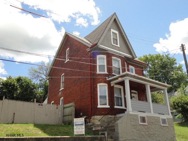 Brick 2.5 story on large city lot. 4 bedroom, including large finished 3rd floor bedroom and 1.5 baths. Hardwood under carpet. 1st floor laundry hookups, sunroom facing large back yard. 11 new windows, new furnace, newer rolled roof over slate. Great family home with lots of space to grow inside and out. Good bones with newer mechanics.    2017 taxes-----716.00   from reaccessment sheets