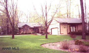 CONTEMPORARY ONE STORY WITH 3 BR, VAULTED CEILINGS & SCREENED REAR PORCH.  CONTEMPORARY ONE STORY ON A PRIVATE WOODED ALMOST 1/2 ACRE LOT.  THIS 3 BR FEATURES VAULTED CEILINGS, CENTRAL VAC, CEDAR WIC, SECURITY SYSTEM, 2 CAR GARAGE AND MUCH MORE!