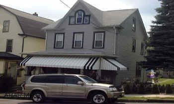 Immaculate 2.5 story with fenced double lot.Tastefully decorated with new oak kitchen,first floor bath,c/a,alarm system,finished third floor with heat/,c/a,garage with workshop,low taxes and utilities.Must be seen. Sellers to find suitable housing. Immaculate 2.5 story with fenced double lot.Tastefully decorated with new oak kitchen,first floor bath,c/a,alarm system,finished third floor with heat,c/a,garage with workshop,low taxes and utilities. Must be seen.Sellers may help with closing costs.
