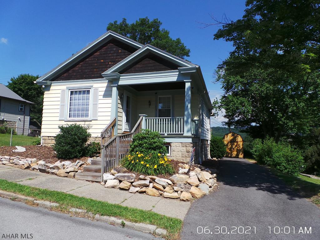 Cut & cozy 2 Bedroom home on a corner with 4 city lots!  Awesome view from the rear sun porch!  All appliances included.  Tax card shows address as 100 & 102 Pine for lot and 104 & 106 for house.