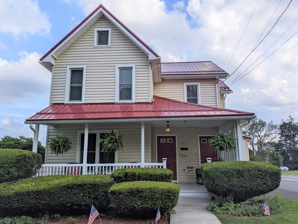 This well-maintained home features an updated kitchen, 4 bedrooms, 2 baths (one with jacuzzi)  and first floor laundry. Walk out to the spacious back patio and enjoy outdoor living surrounded by privacy fencing, a variety of flowers/fruit bushes, and garden. This home features gas hot water reflective heat plus Mitsubishi heat/AC mini-splits (3 units 1st Fl and 1 unit 2nd Fl).  Lifetime metal roof and Simington windows with lifetime replacement. The main and second floors each include two bedrooms and a bath,  and there is an auxiliary kitchen on the 2nd floor.  This home is a single family home but can easily be converted to a second floor rental unit if needed. One car detached garage with room for additional storage; walk-up attic. Easy walk to all that Ebensburg offers!