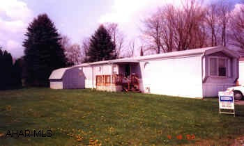 1994 3 BEDROOM, 2 BATH IN EXCELLENT CONDITION.  IMMACULATE 3 BR, 2 BATH, CENTRAL AIR. ALL APPLIANCES STAY INCLUDING WASHER AND DRYER. MOST FURNITURE STAYS ALSO INCLUDING THE KITCHEN TABLE, CHAIRS, BUTCHER BLOCK, SOFA, CHAIR, TWO STEEL CABINETS AND ALL WINDOW TREATMENTS. LOT IS RENTED AT $175 MO. PLUS UTILITIES. BEAUTIFUL QUIET LOT IN PRIVATE AREA.