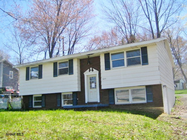 CRESSON AREA BI-LEVEL in need of some TLC. This home is a great opportunity for the right buyer. Nicely updated kitchen with large dining area, spacious formal living room, 3 bedrooms and 2 full baths. Semi-finished basement, large wood deck, off street parking, 2 zone gas hot water heat. AS-IS addendum required. Seller will make no repairs.
