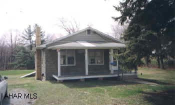 2 BEDROOM HOME LOCATED ON A LEVEL 2.54 ACRE LOT WITH STORAGE SHED AND 2 CAR DETACHED GARAGE. NEW OIL HW FURNACE. TAKE 865 THRU BELLWOOD TURN RIGHT AT BACK ROAD TO TIPTON. HOUSE IS ONE THE RIGHT. PROPERTY TO BE ASST. FOR PUBLIC SEWER.