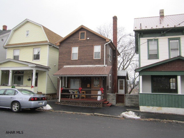 Nice two bedroom home with log siding. Features include newer metal roof, mostly replacement windows and new carpeting.