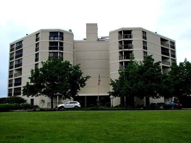 One-story living in this very spacious Park View Condo. Large corner unit with 3 balconies, great views overlooking Park Hills Country Club and Golf Course.  Garage parking, storage unit, security system, common patio, social room, library, and exercise room.  Association fee includes water, trash removal, and outside maintenance.  This is also a fire-proof building.