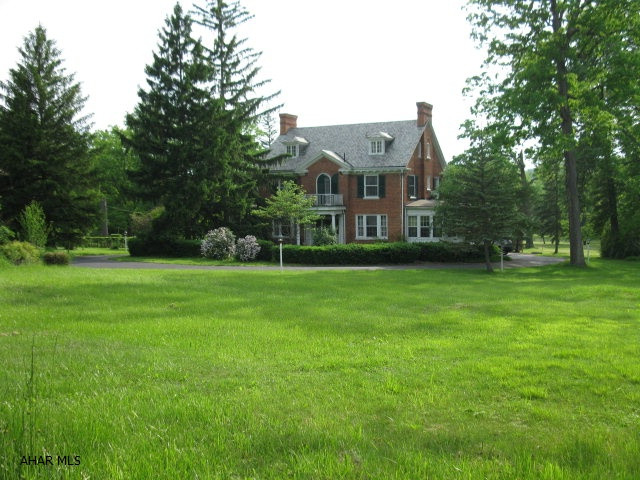 CLASSIC 12 ROOM GEORGIAN BRICK WITH LARGE FORMAL ROOMS, CENTER FOYER WITH LEADED GLASS AND GRAND 3 STORY WINDING STAIRCASE.  THIS ELEGANT ROARING 20'S LADY IS A BEAUTY WITH STYLE AND UNLIMITED POTENTIAL! 2.5 ACRE GROUNDS HAVE MATURE LANDSCAPING, CIRCULAR DRIVE, 4 CAR GARAGE.  TLC NEEDED - SELLING AS IS.  OUTBUILDINGS AND INGROUND POOL NEED TOTAL RENOVATION OR TO BE TORN DOWN. ORIGINAL FURNACE AND SLATE ROOF. QUALIFIED BUYERS BY APPOINTMENT ONLY.  NO DRIVE BYS.