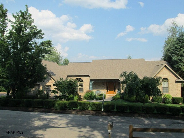 One of the most impressive homes in Blair County! This custom built all brick home has been spared no expense in upgrades. All doors are solid 6 panel, granite, tile and boasting vaulted ceilings throughout. Oversized Master Bedroom Suite with private 2nd story patio. The bright and cheery kitchen has a breakfast area that overlooks the Koi and duck pond. The full finished lower level features a custom granite kitchen/bar, very private covered patio and gas fireplace. Custom indoor lap pool & sauna. Tempered wine storage, 6 zone heat, dog play area, and so much more. A must see for the qualified buyer!