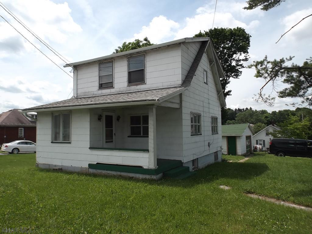 Commercially zoned two story on large corner lot.  Could be a starter home, rental or small business location.  NEWLY PAINTED AND CARPETED interior.  Park in driveway or on side street; lockbox on rear porch door,