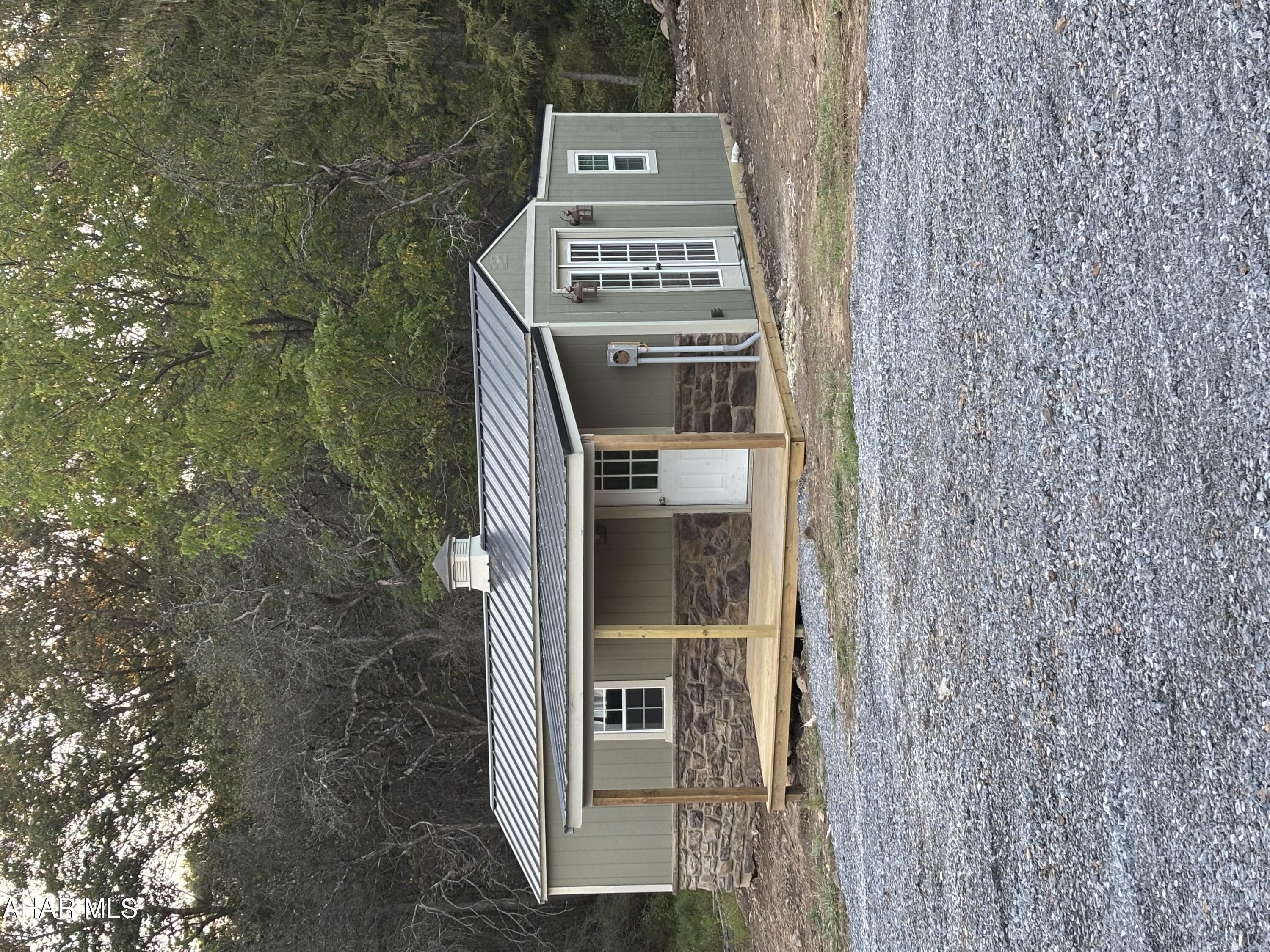 Looking for a low-maintenance getaway? This 300 sq ft tiny home offers everything you need in a compact space--all within minutes of Lake Raystown. Featuring public water, sewer, and electric, the home includes a full bathroom for convenience. Outside, you'll find room to park your boat or expand on the lot to suit your needs. The property's location provides easy access to State Game Lands for outdoor recreation, and it sits within the Tussey Mountain School District. Whether you're seeking a cozy retreat, hunting camp, or base for lake adventures, this property is ready to welcome you.
Private Remarks: Tiny home is not on a foundation but does have public water, public sewer, electricity, and heat and AC.
This home can not be used as a primary, year round residence.
