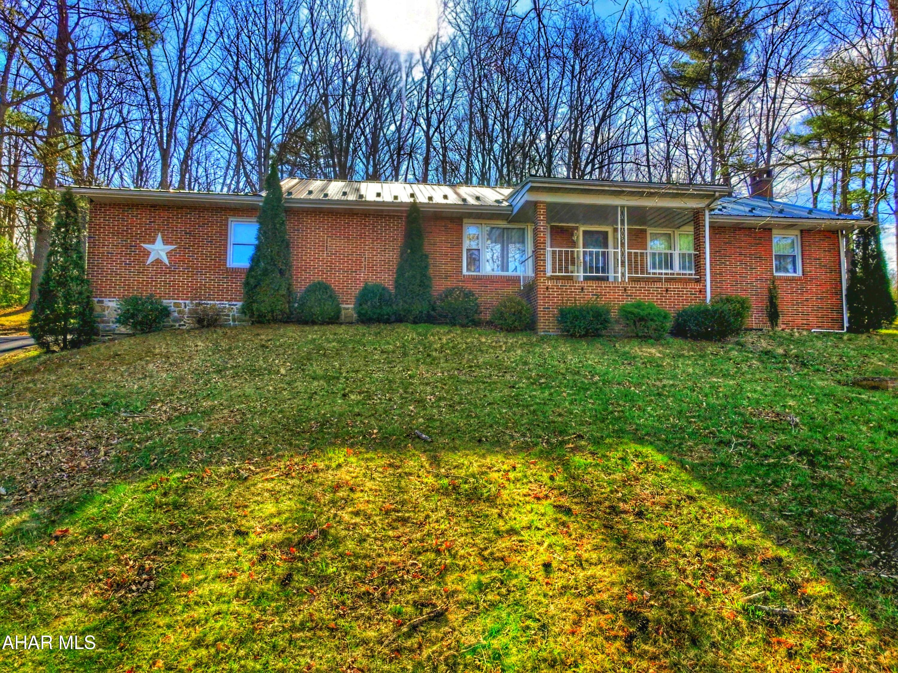 Price Reduction! Hard to find one level living Full Brick Ranch Home. Circular paved driveway for easy access in and out. Drive around back to the 2 car garage which has lots of  good space, has pull downsteps to the attic storage. Walk in the back door to the eat-in kitchen. Lovely hardwood flooring in the living room and under carpets in the bedrooms. Laundry hook-ups have been moved to main floor. Basement is finished with family room featuring a gas or wood fireplace, 2nd kitchen and 2nd bathroom area. Bonus room in basement that could have many uses.  Outside enjoy the  large yard with a great view. Heat is oil F/A along with central air. See disclosure addendum. Septic has been repaired and inspected. Water has a new UV light.  Call today for an appointment to make this your new home!