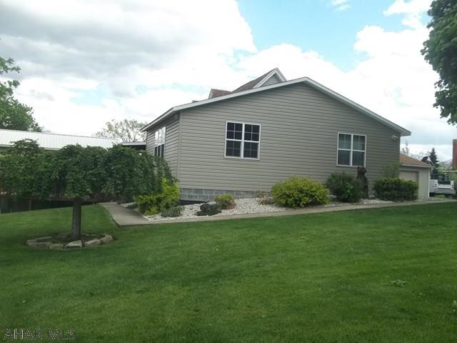 Updated 4 bedroom home with a 2 car garage, above ground pool and hot tub. The work shop is a newly built large garage space that has many uses. This home is a spectacular home that has so much to offer and more. The outside area is a wonderful place for entertaining and there are no worries for parking with the wrap around driveway. The updates, the lot size, and the amenities make this one a winner! Call or text to set up your private showing today.