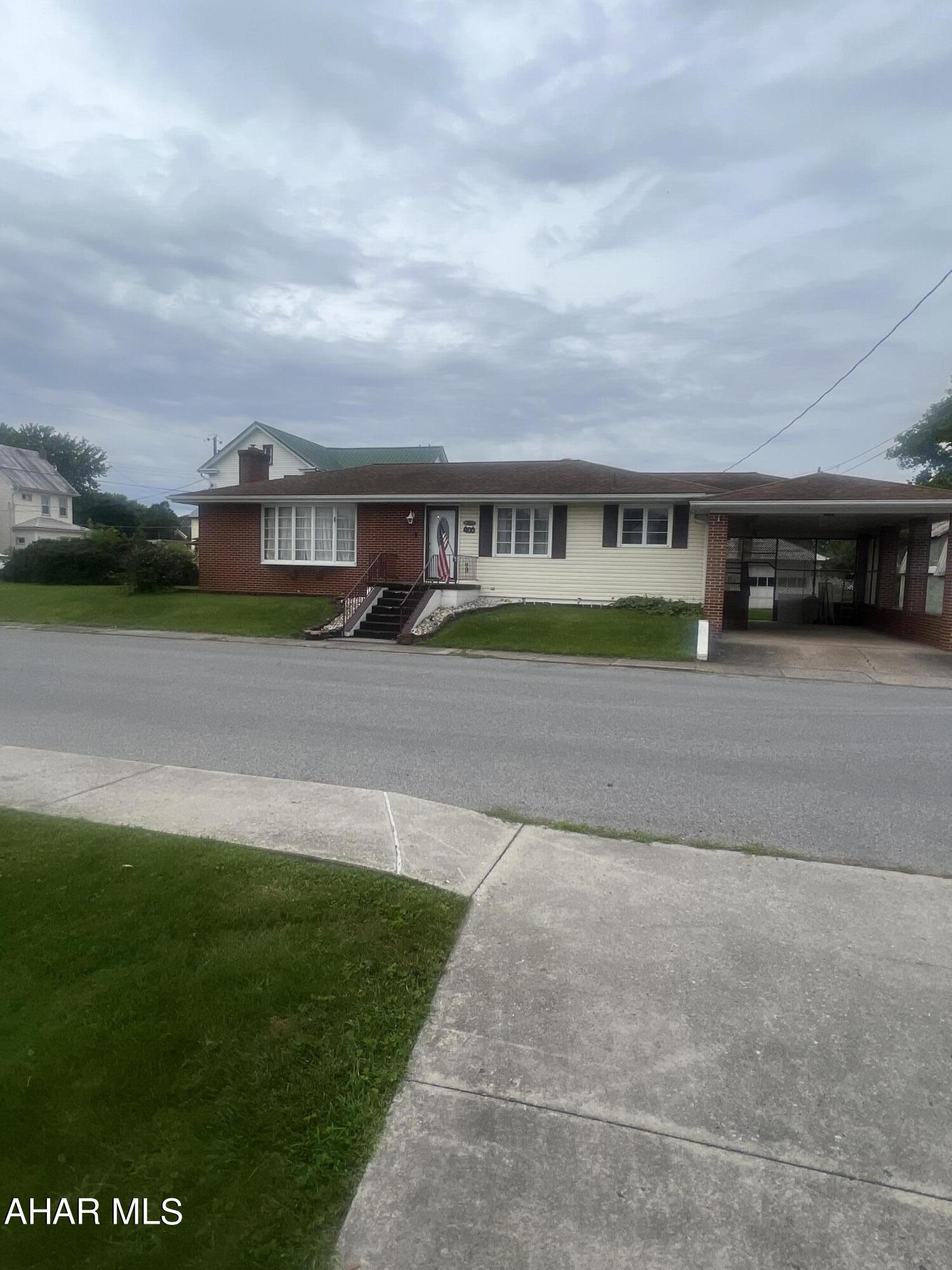 Three bedroom ranch on corner lot. Open floor plan with fireplace in Living Room.  Basement has 1/2 Bath, storage and could be finished for additional living space.