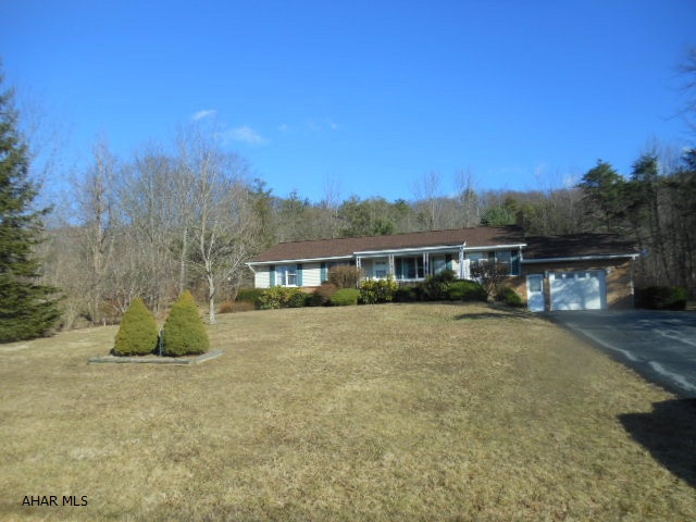 Watch the anglers reelin' in the fish at Canoe Creek and take in the beautiful mountain views from the front porch of this lovely Ranch home privately situated on a nice 100x200 lot. Very nice eat-in kitchen, formal dining room that opens to the relaxing covered back porch. Large living room w/ views of the water, family room that opens to front porch and back yard too. Master bedroom has a private bath. Attached garage has additional entrance to huge unfinished basement. Comfortable living in this ready to move in country home !
