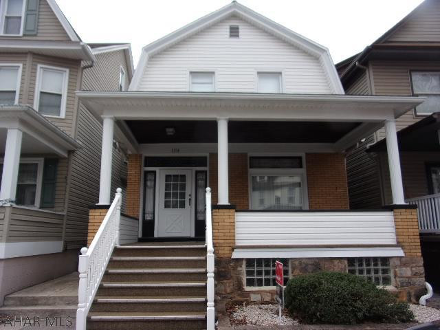 Classic brick with 3 bedrooms, 1 bath and second floor sunporch, perfect for relaxing in the summer.  Original front door with leaded glass panels, beautiful stained glass windows in DR and oak stairway.   Seller says there are hardwood floors under carpet.  2 bay detached garage and manicured yard.  Lots to offer at this price!