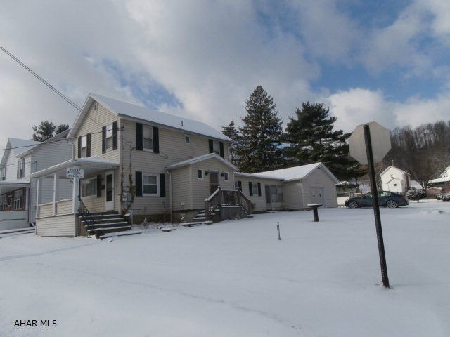 Nice two story with breezeway and attached garage. Garage is a two car size with a one car door. Great location. Large corner lot. Needs some interior updating. Priced to sell.