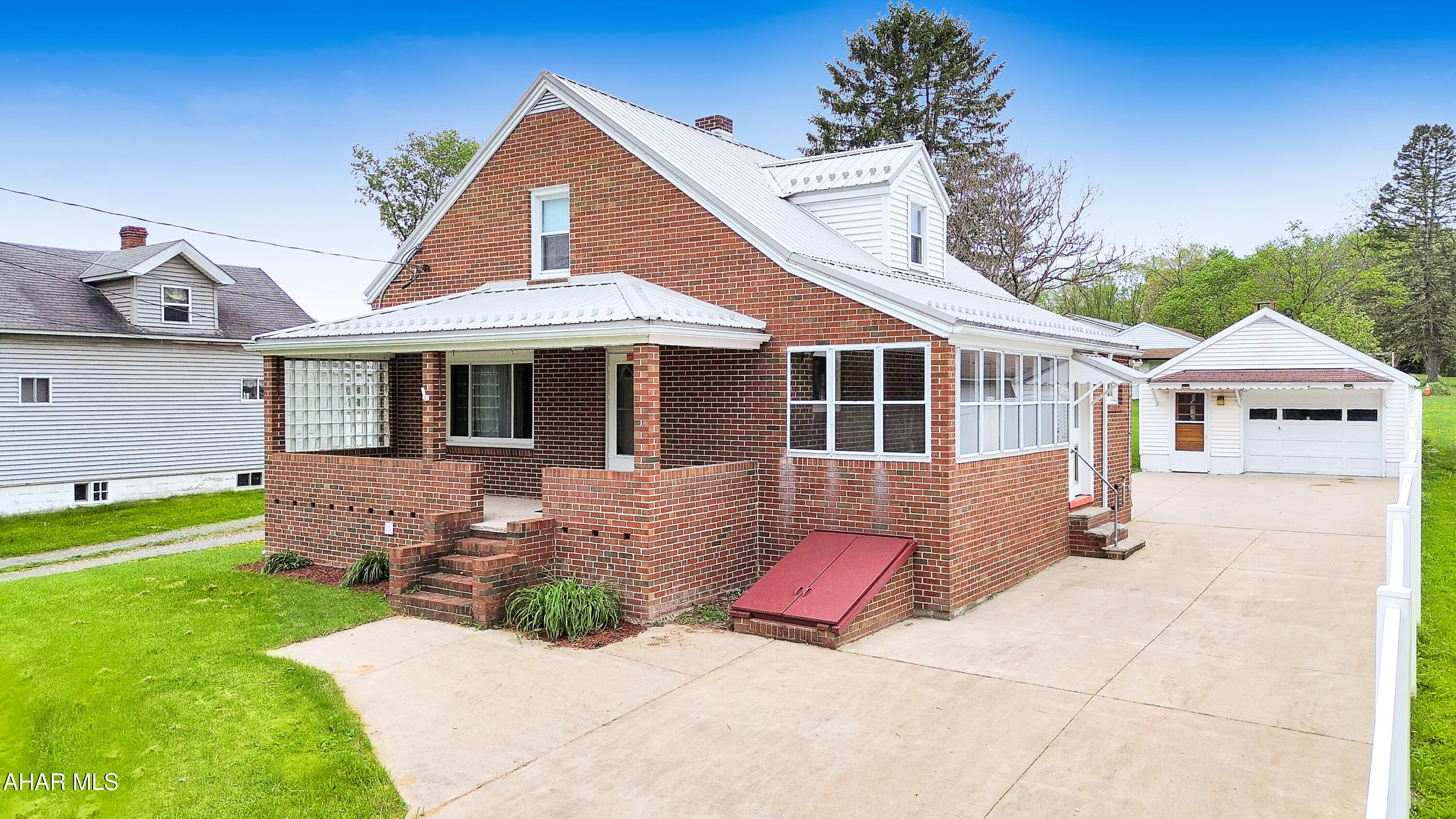 Welcome to 222 Route 403 in the Penns Manor School District! Situated on 0.98 acres, this beautifully maintained all-brick Cape Cod showcases true pride of ownership throughout. The main floor features a spacious living room filled with natural light, formal dining room, large eat-in kitchen with a center island, mudroom, and a bright sunporch perfect for relaxing or entertaining. Upstairs you'll find two generously sized bedrooms, each offering matching dual walk-in closets with custom built-ins, along with a beautifully updated full bathroom featuring a walk-in tile shower. Throughout the home you'll notice meticulously maintained hardwood floors, stunning oak trim, and timeless character. The basement offers excellent storage, laundry area, shower and toilet, mechanicals, and endless potential for additional use. Outside, the property features a large concrete driveway, one detached two-car garage & a one detached one-car garage, spacious yard, and so much more. Call today to schedule your private tour of this exceptionally cared for home!