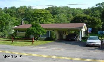 Vinyl Rancher on 3/4 Acre. 3 Brms, BA, Kitchen L.R., Carport, Shed, Large Basement. Possible Horses?